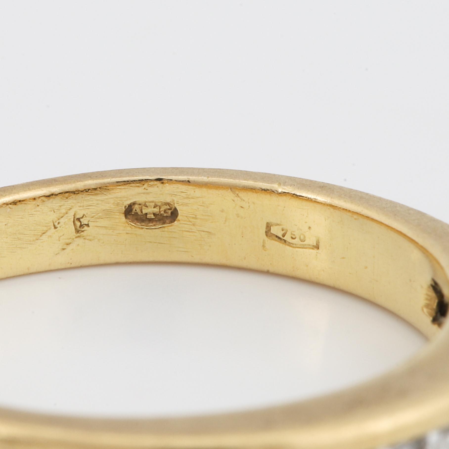 Step-cut diamond ring.
