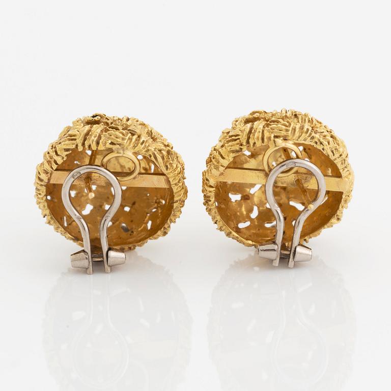 A pair of 18K gold earrings.