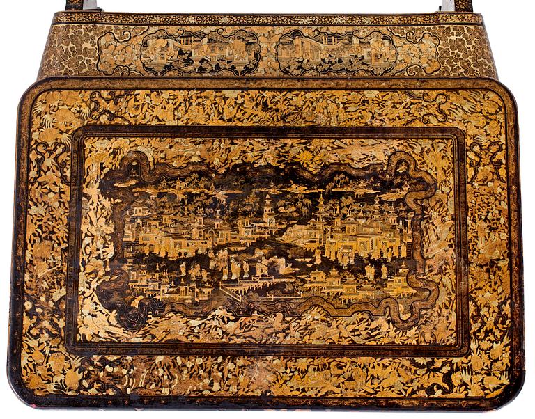 A gold and black lacquer sewing table, Qing dynasty, ca 1800.