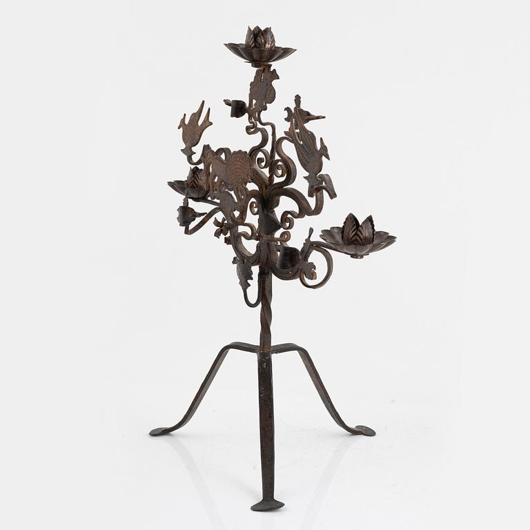 A wrought iron candelabra and a pair of wall sconces, Italy, mid/second half of the 20th century.