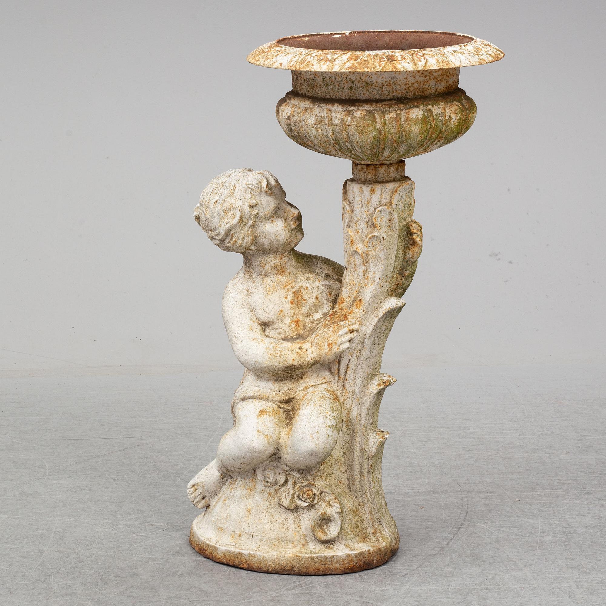 An end of the 20th Century cast iron flower pot.