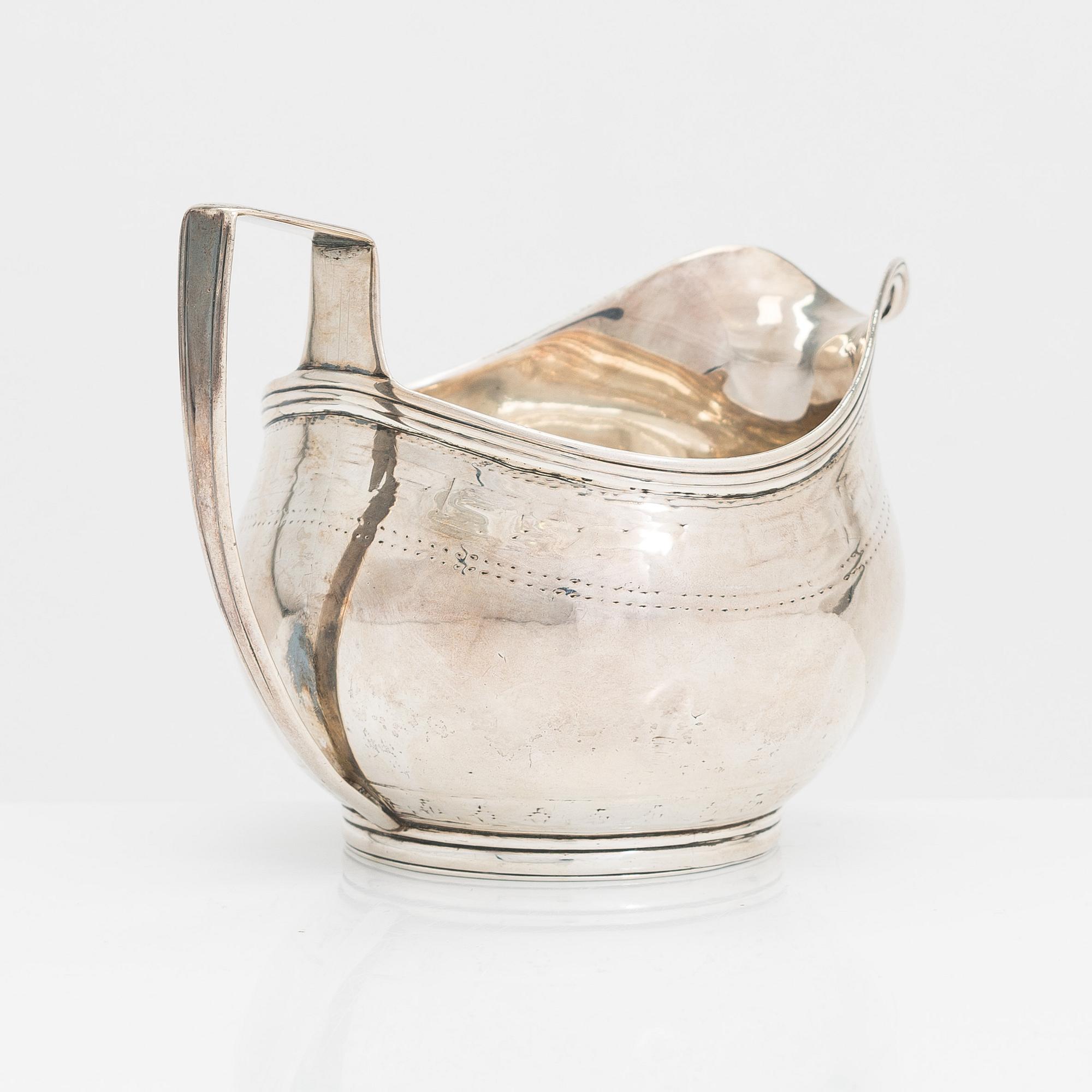A Georgian sterling silver jug, late 18th century. Worn marks.