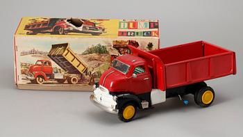 A Japanese Yonezawa Dump truck and a German MS Magirus lorry, 1950s.
