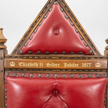 A oak and leather throne commemorating Elizabeth II silver jubilee 1977 by Wood Bros. Ltd.