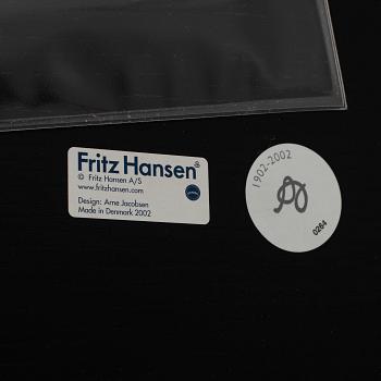 An Arne Jacobsen "Centenary Package" comprising three "Ant Chairs" and an eggshaped table, Fritz Hansen, Denmark.