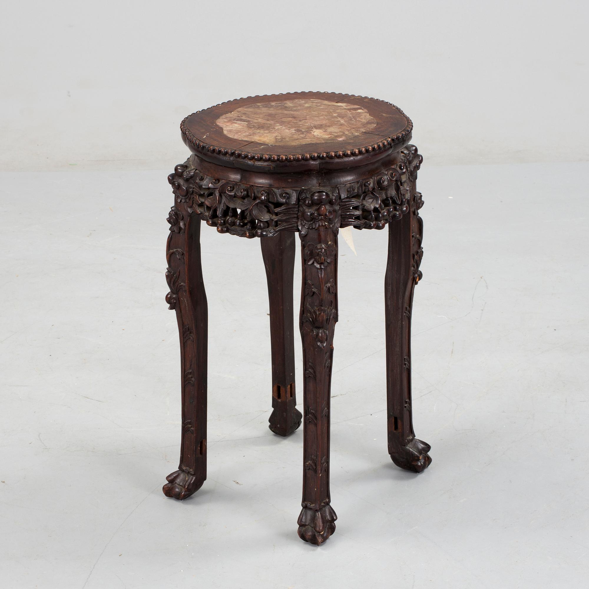 A hardwood table with marble top, China, 20th Century.