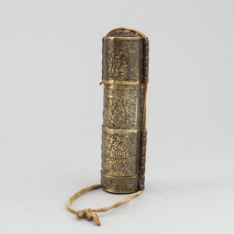 A Tibetan prayer roll and a metal roll with compartments with prayer rolls, 19th Century.