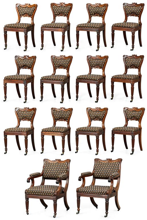 A set of late Regency twelve chairs and a pair of armchairs.