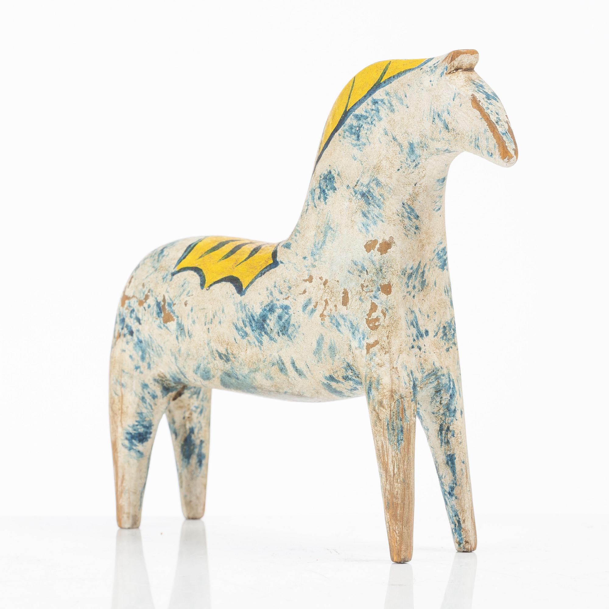 A carved and polychrome painted Dalecarlian horse, circa 1900.