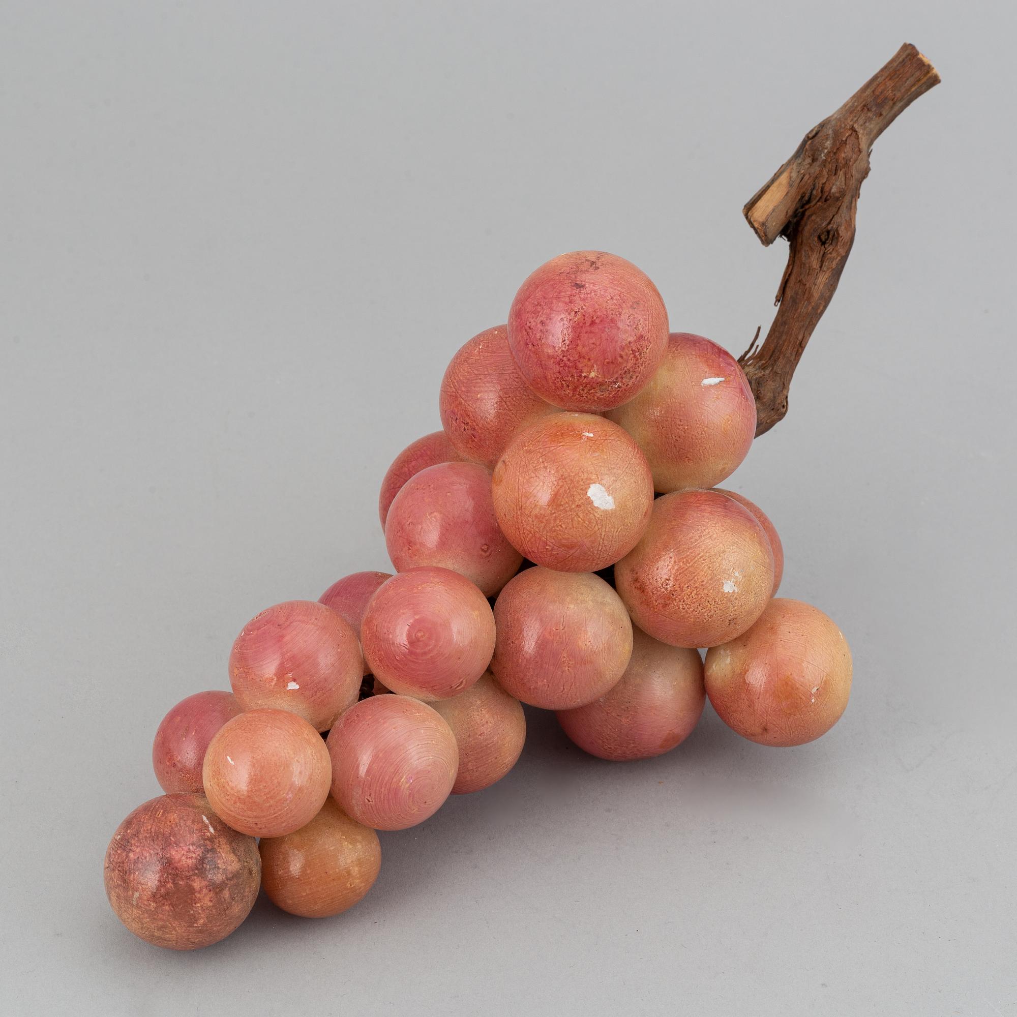 13 stone table decorations of grapes, 20th century.