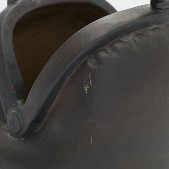 Outi Leinonen, a ceramic vase formed as a purse for Pentik, Finland.