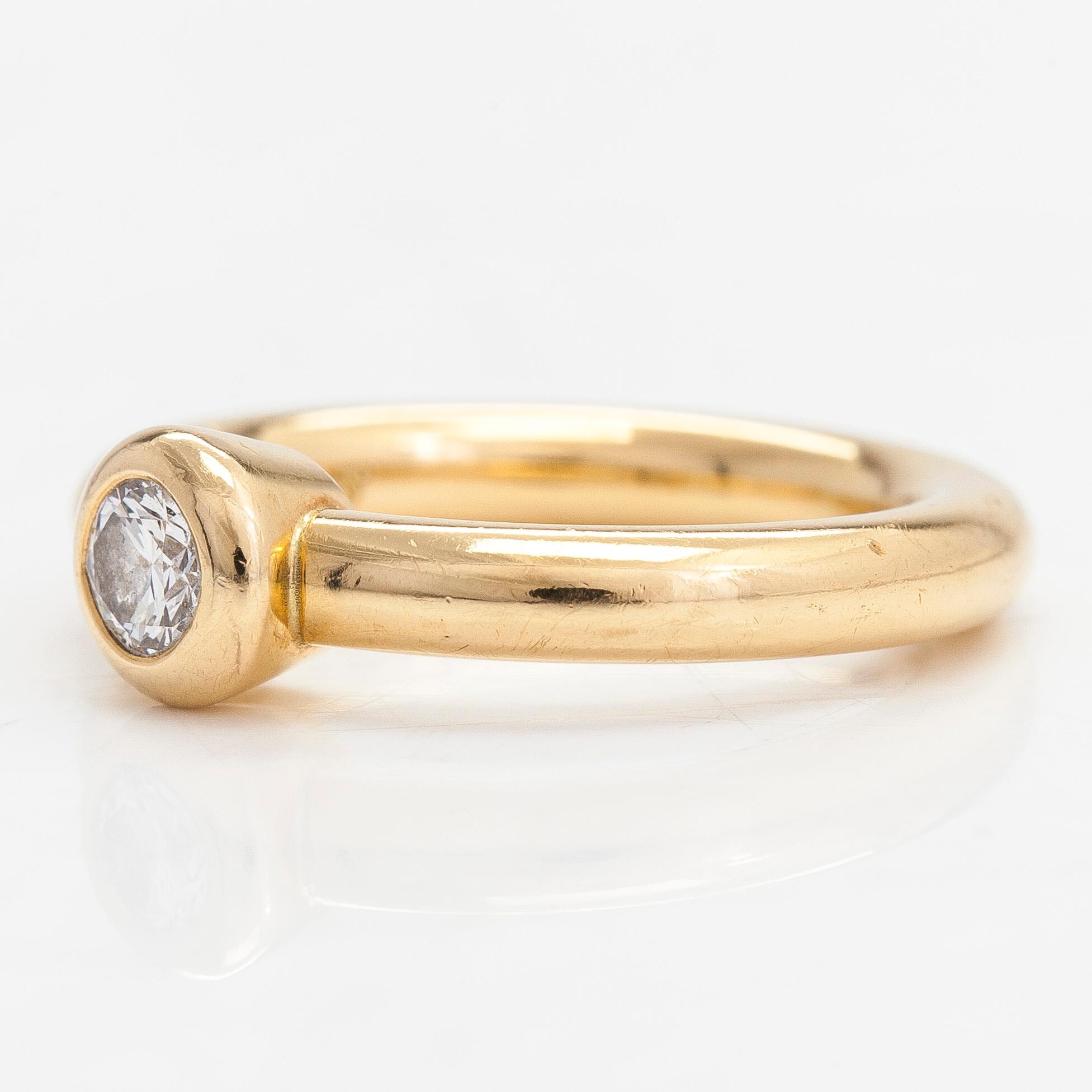 Torbjörn Tillander, ring, 18K guld med en briljantslipad diamant ca 0.25 ct. Helsingfors 1998.