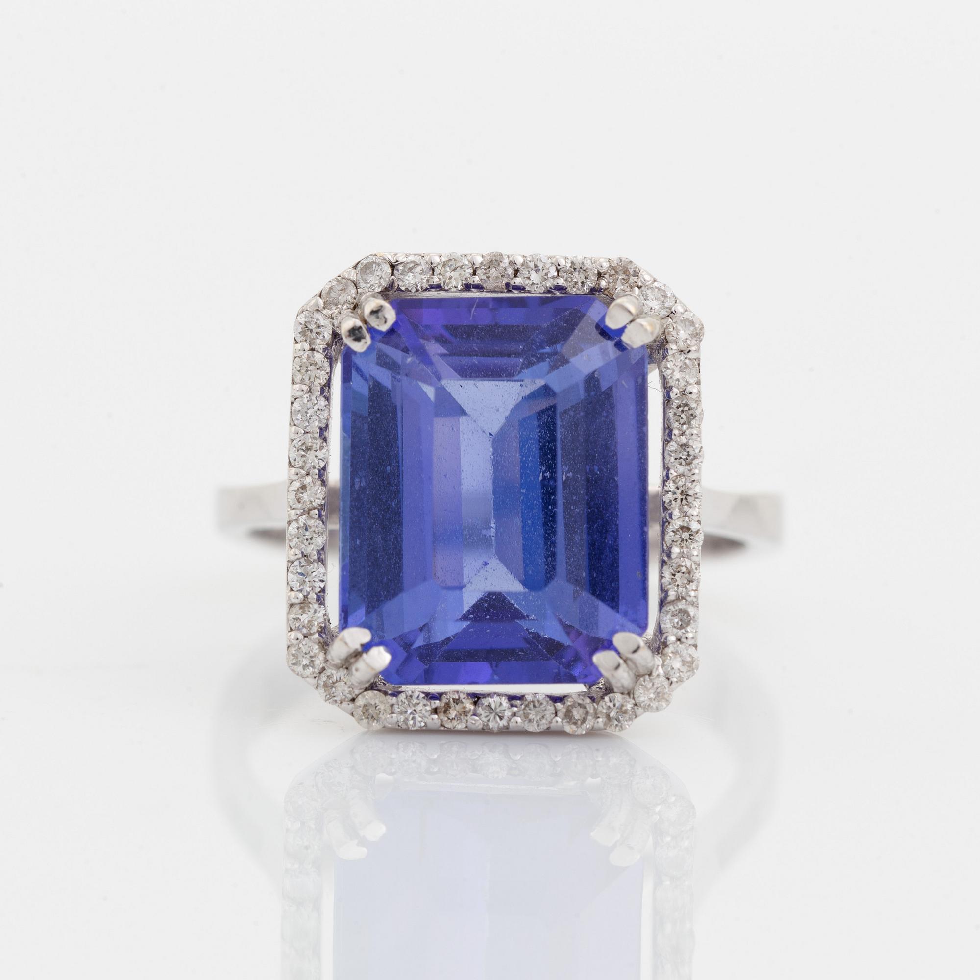 Emerald cut tanzanite and brilliant cut diamond cocktail ring.