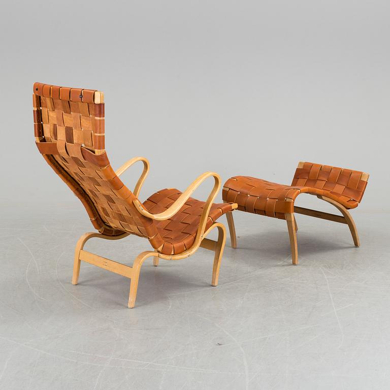 An easy chair with stool by Bruno Mathson.