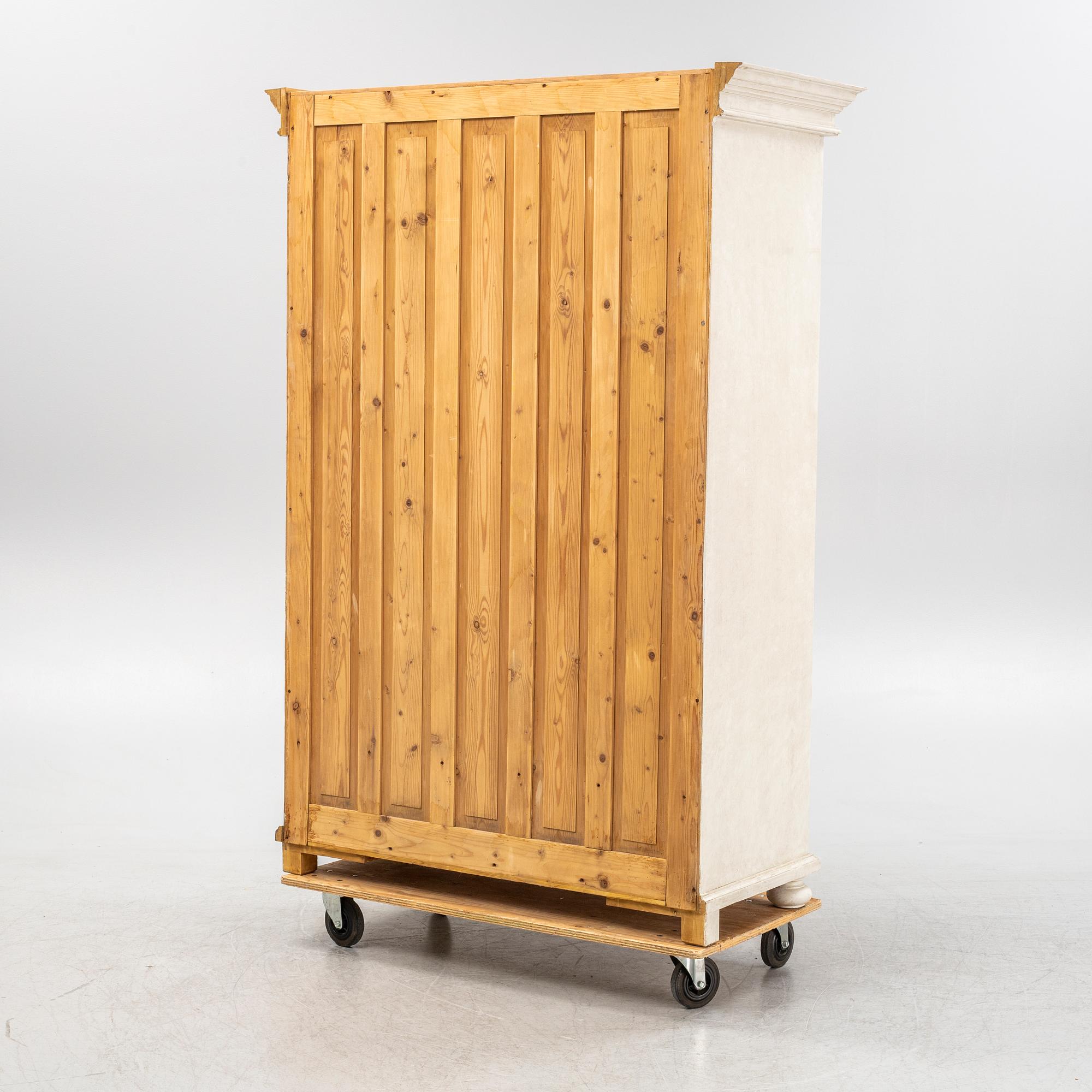 A painted clothes cabinet, 21st Century.