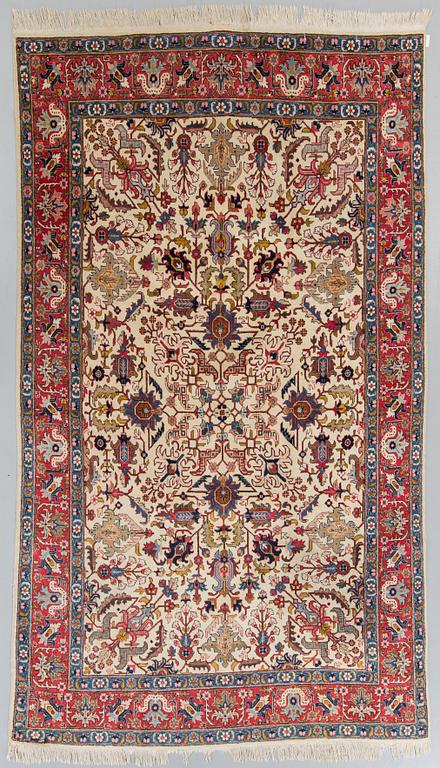 A semiantique Tabriz carpet ca 324 x 207 cm.