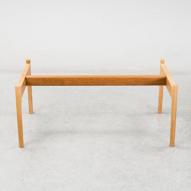 A model JH 575 coffee table by Hans J Wegner for Johannes Hansen.