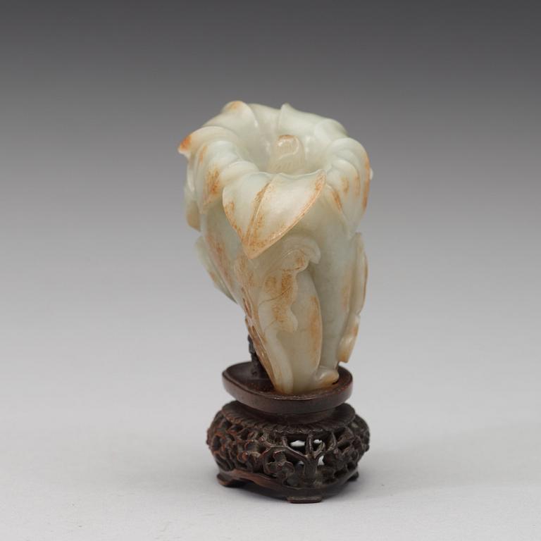 A celadon nephrite floral group, Qing dynasty (1644-1944).