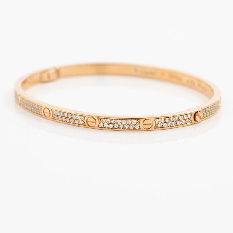 A Cartier bangle "Love" 18K rose gold with round brilliant-cut diamonds.