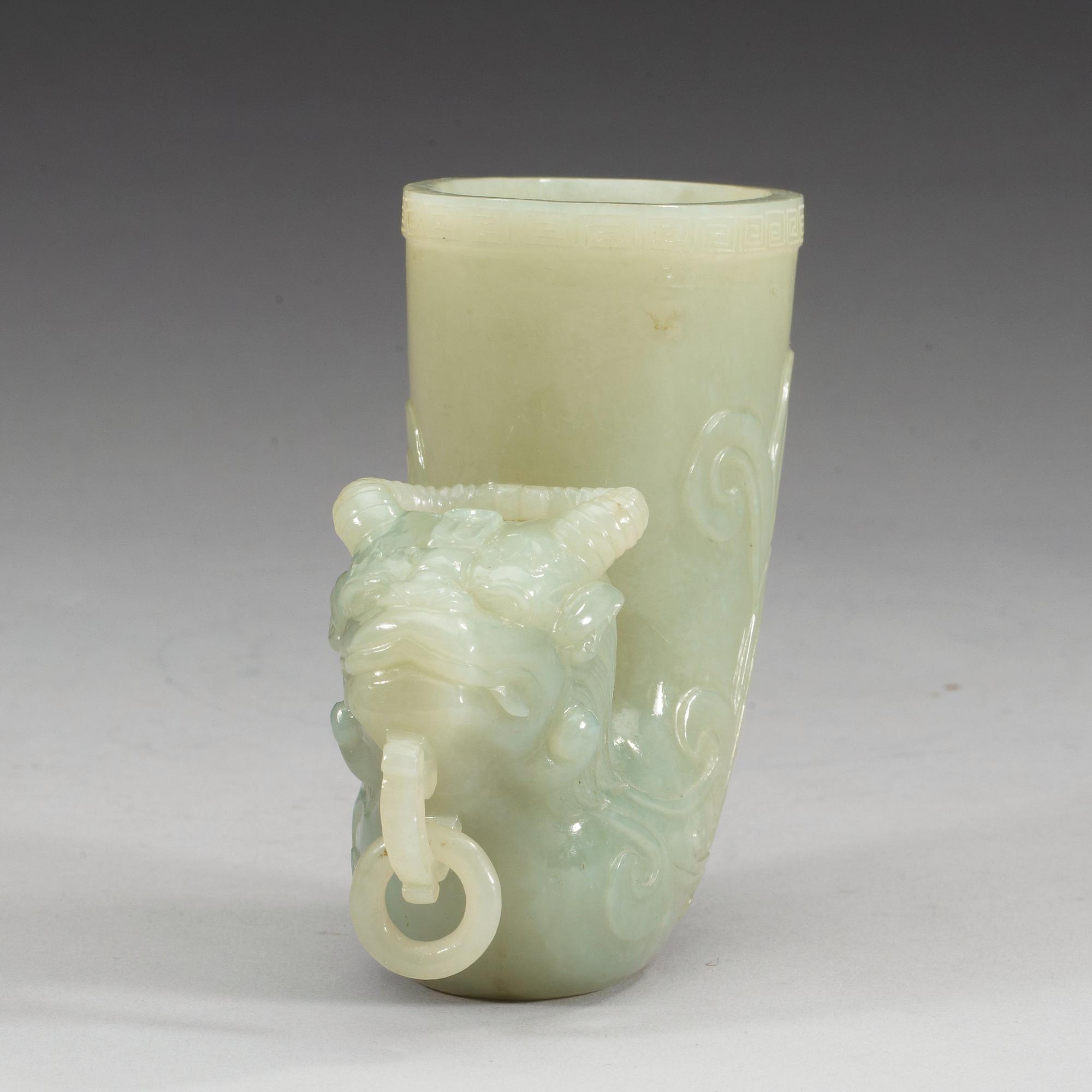 A Chinese carved nephrite rhyton beaker.