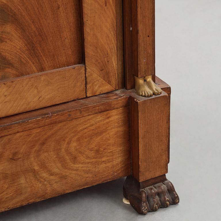 A French Empire mahogany and gilt-bronze mounted bibliothèque, early 19th century.