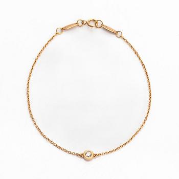 Tiffany & Co, Elsa Peretti, an 18K gold bracelet, 'Diamonds by the Yard', with a diamond approximately 0.08 ct.
