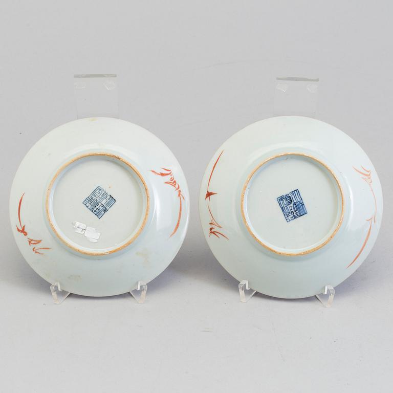 A pair of Chinese powder blue porcelain cups with dishes, Qing dynasty, Qianlong (1736-95), with Qianlongs mark.