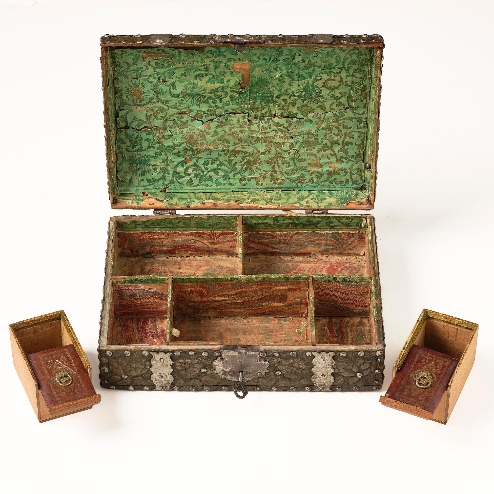 A presumably German baroque repoussé brass writing box, late 17th century.