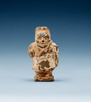 A small potted figure of a man, Han dynasty (206 BC - 220 AD).