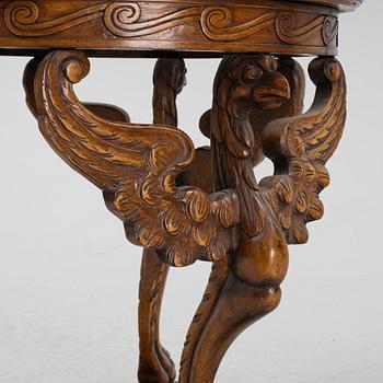 An oak sidetable with stone top, early 20th Century.