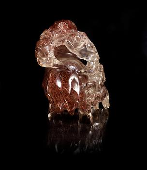 A carved quartz figure of a reclining deer with a dog and som fungus, China, early 20th Century.