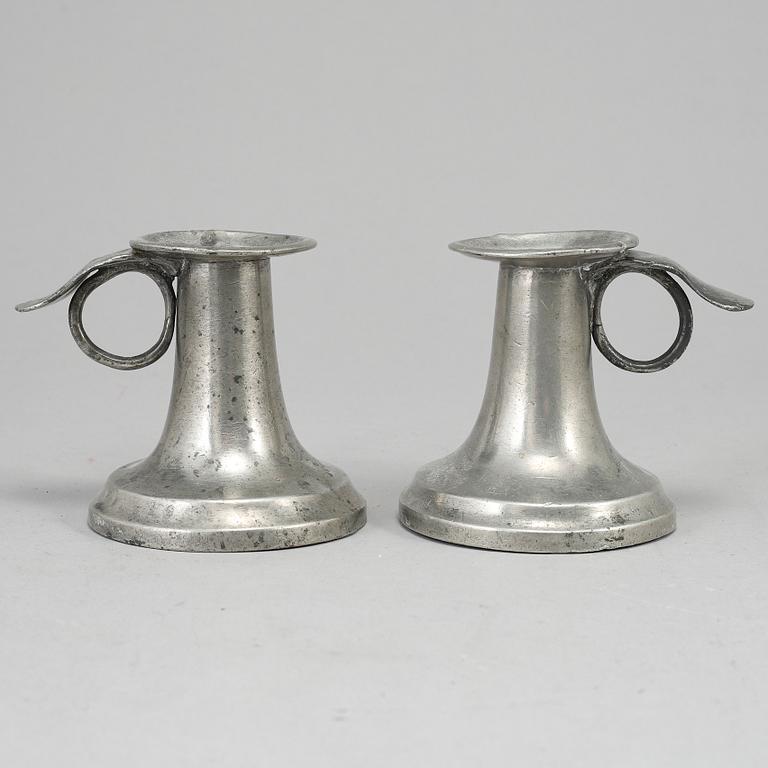 A pair of 19th century pewter candlesticks.