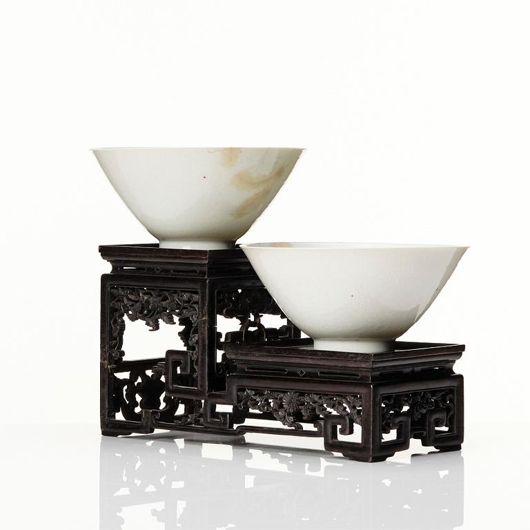 Two Chinese white glazed anhua decorated dragon bowls, Qing dynasty.