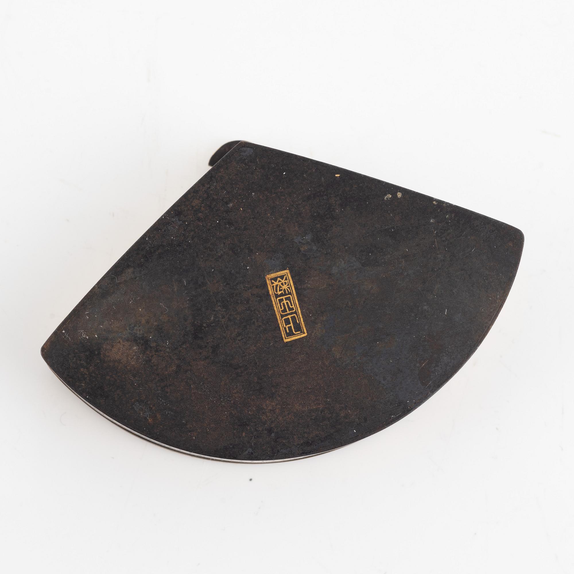 A Japanese gilt-bronze fan-shaped box and gilt iron tsuba with mei inscription, Meiji period (1868-1912).
