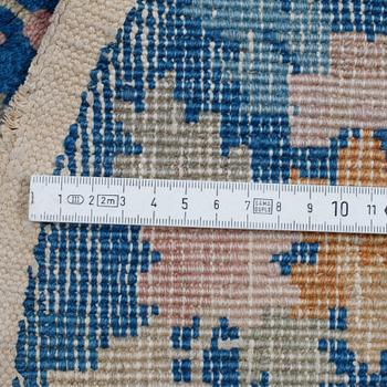 A pair of semi-antique/Old, Chinese rugs, ca 138 x 77 cm.