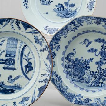 Four blue and white export porcelain plates, three soup plates and a serving dish, Qing dynasty, Qianlong (1736-95).