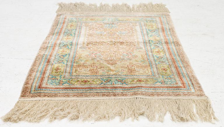 A semi-antique silk Hereke, c. 92 x 61 cm.
