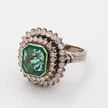 Emerald-cut emerald and eight-cut diamond ring.
