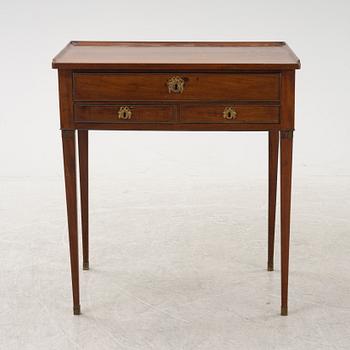A late Gustavian mahogany writing table from araound the year 1800.