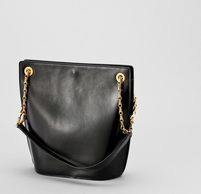 A 1970s black leather shoulder bag by Celine.