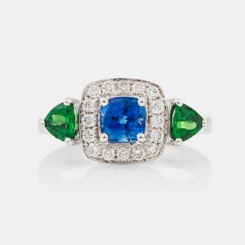 1307. A sapphire, circa 1.30 cts, tsavorite garnet and diamond ring.