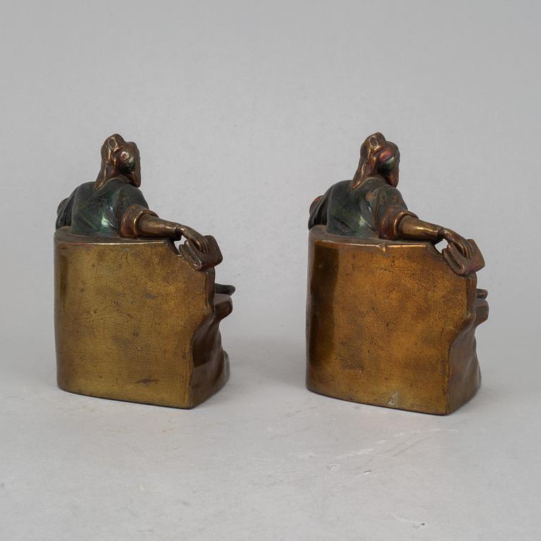 Two brass book ends, 20th century.
