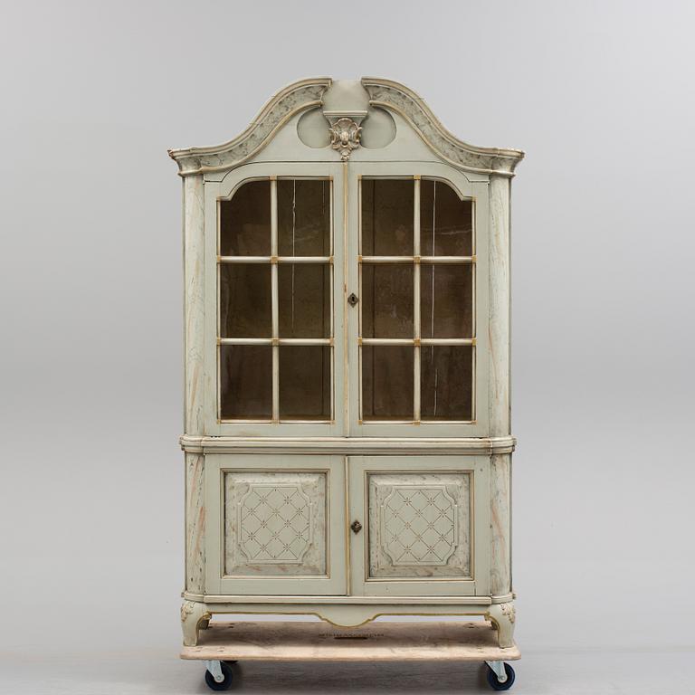 a rococostyle vitrine cabinet from the 19th century.