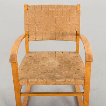 A 1930-40'S ROCKING CHAIR.