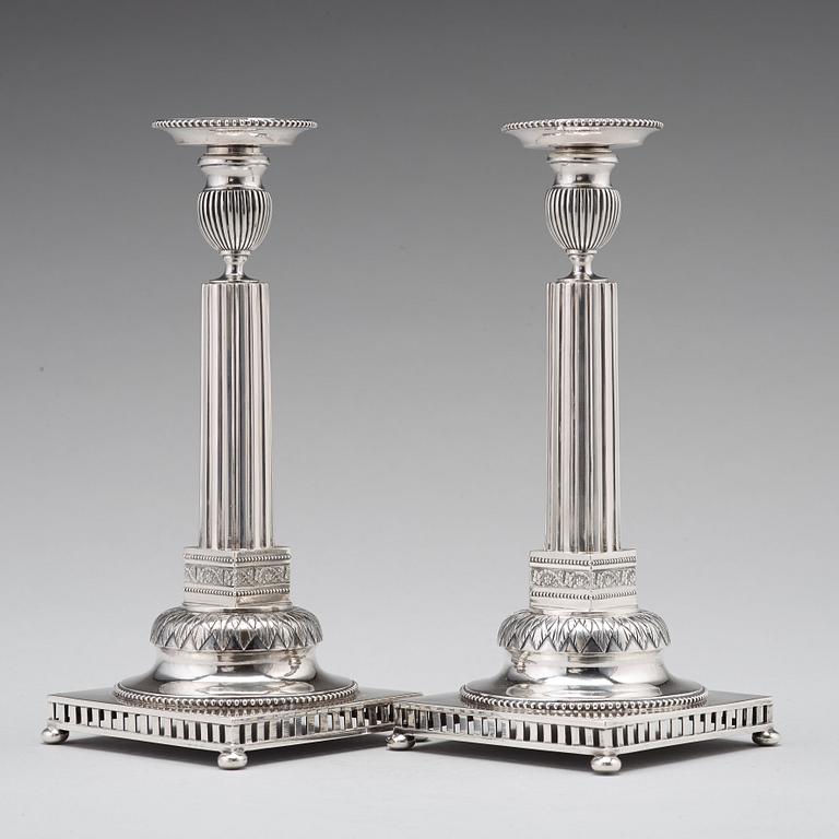 A pair of Swedish 18th century silver candlesticks, Stephan Westerstråhle, Stockholm 1793, one nozzle J E Torsk 1895.