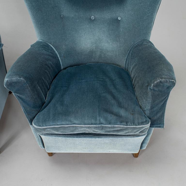 A pair of mid-20th century armchairs.