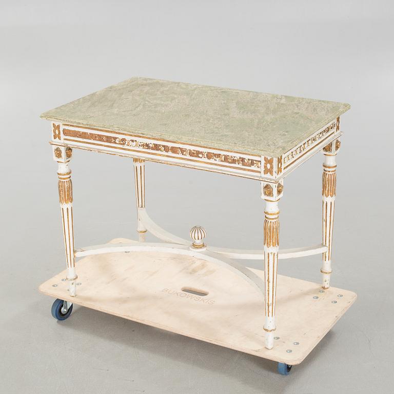 A late gustavian style table, around the year 1900.