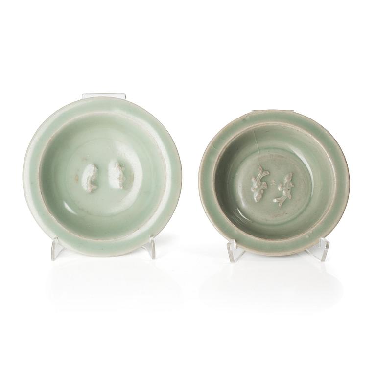 Two celadon glazed double fish dishes, Ming dynasty (1368-1644).