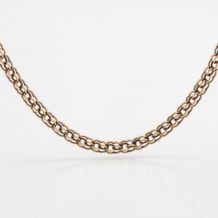 A 14K gold necklace. Aittamäki Ky, Nurmisjärvi 1992.