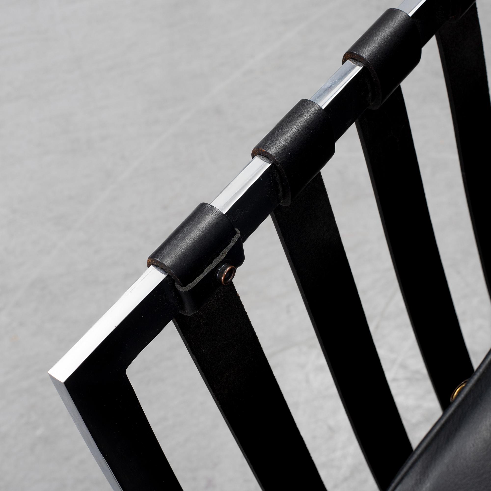 LUDWIG MIES VAN DER ROHE, a 'Barcelona' black leather lounge chair, Knoll Studio.